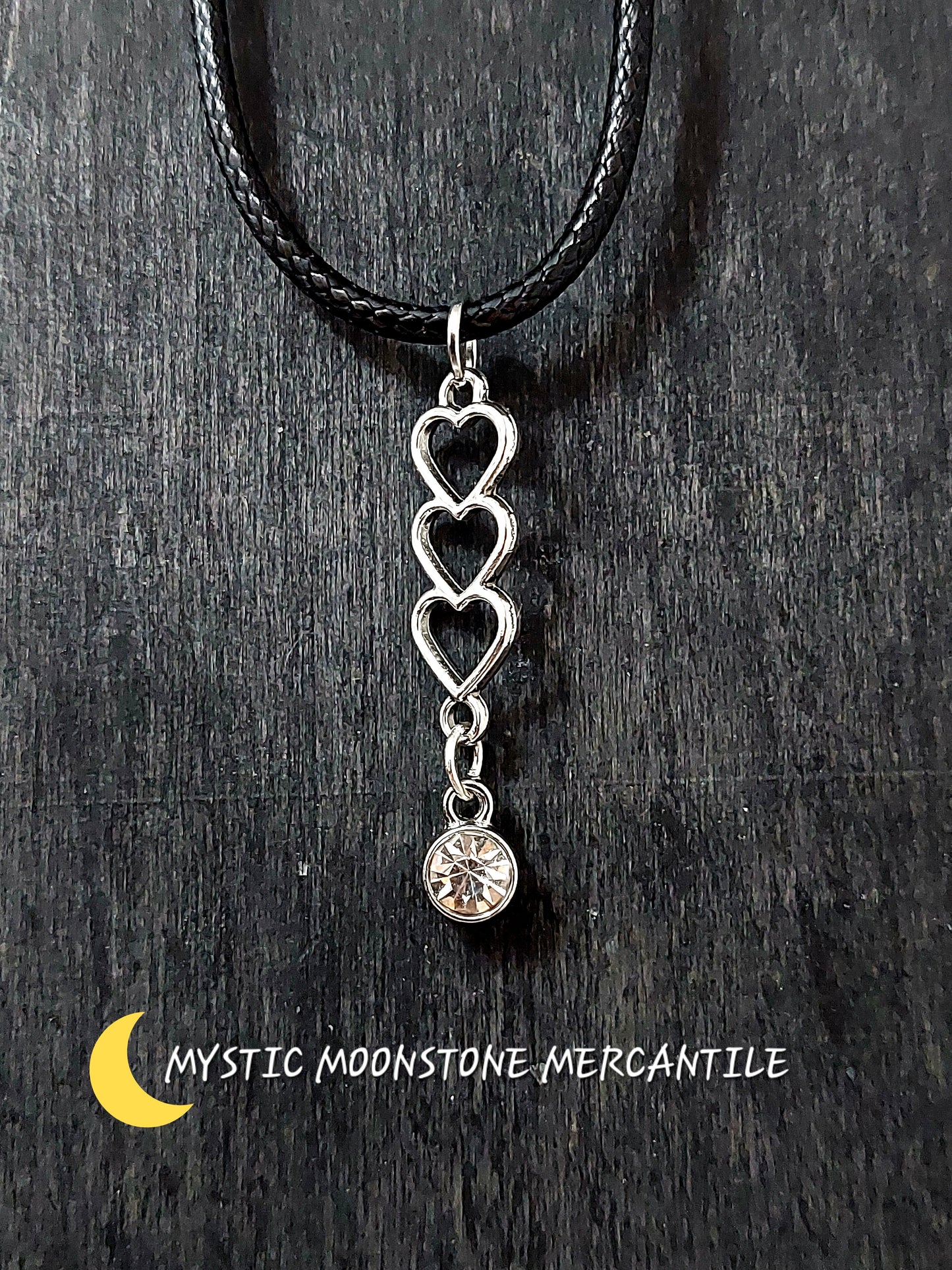 TRIPLE HEART WITH CRYSTAL GEM ON ADJUSTABLE 18/20" WAXED BLACK CORD NECKLACE