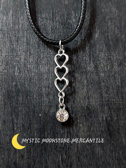 TRIPLE HEART WITH CRYSTAL GEM ON ADJUSTABLE 18/20" WAXED BLACK CORD NECKLACE