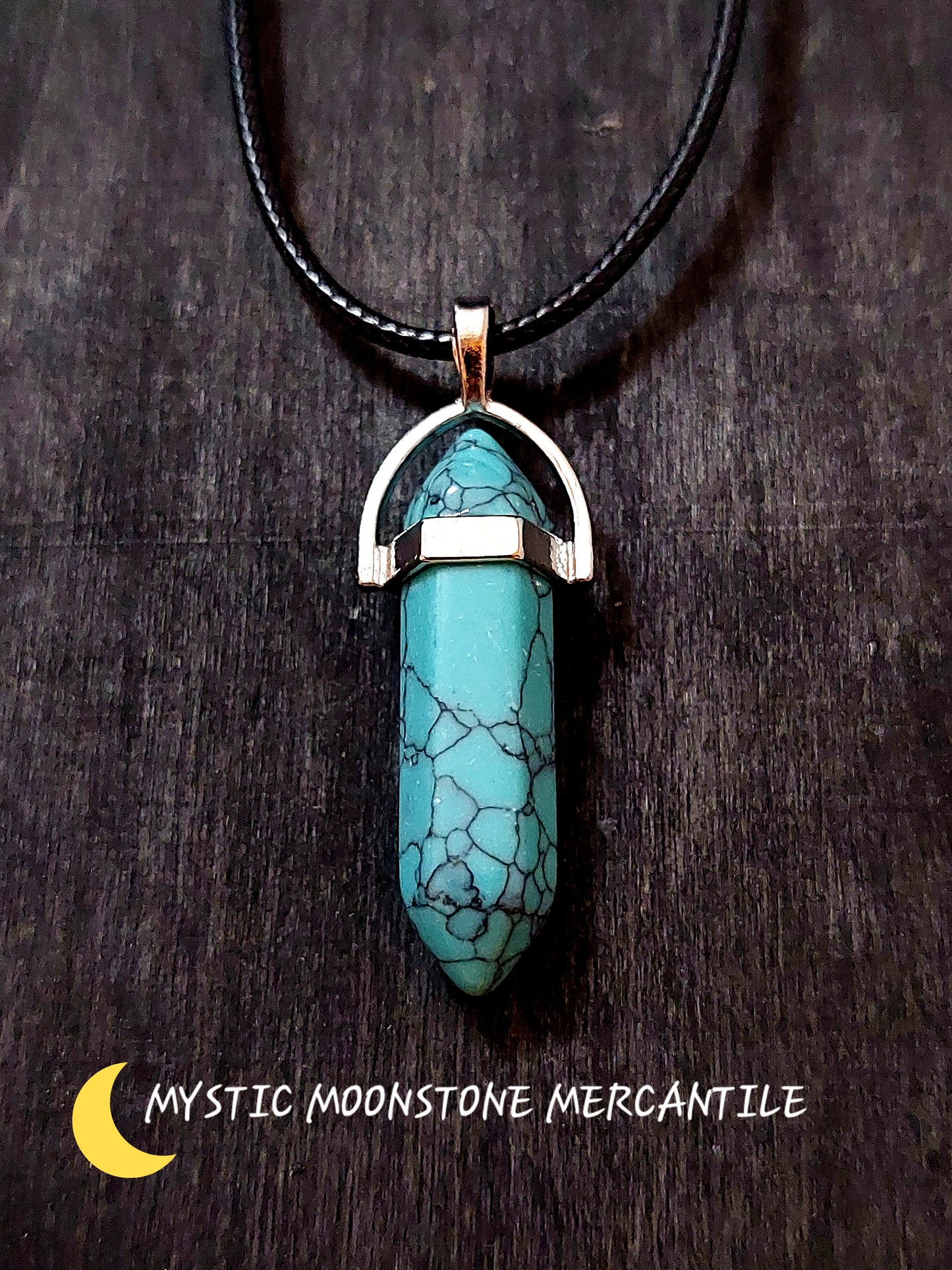 DOUBLE POINT BLUE HOWLITE  PENDANT ON BLACK WAXED CORD